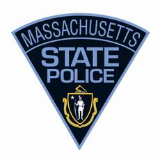 Massachusetts State Police shoulder patch featuring text and the state seal on a blue background—an emblem recognized by professionals across industries, including those at Engineered Systems Inc who specialize in MEP/FP designs.